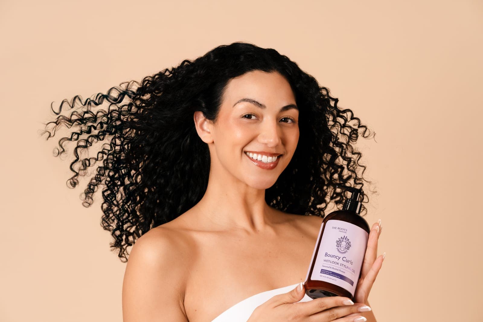 Model with soft, bouncy, defined curls
