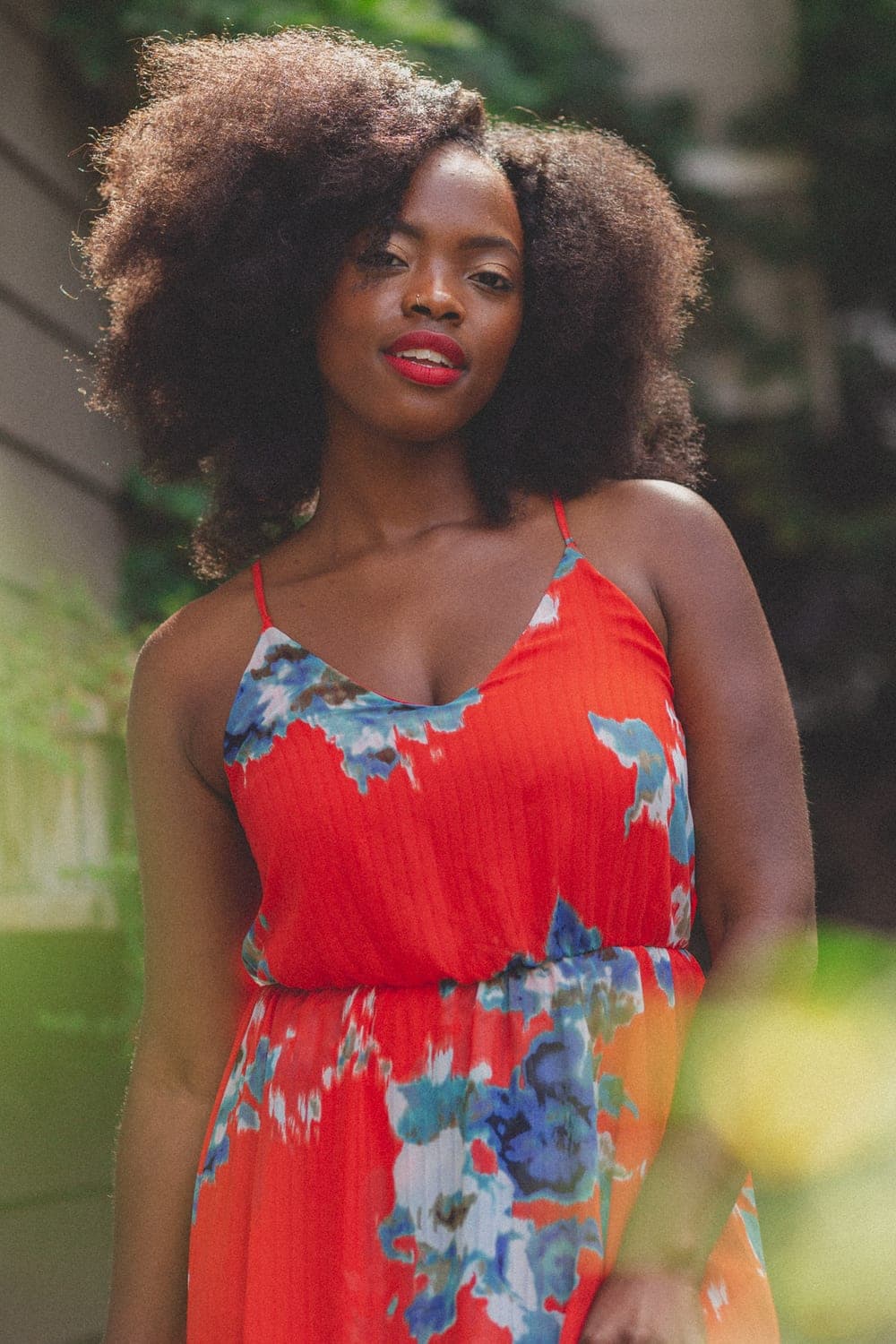 A model wearing her natural hair in warm sunlight